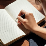 ** A person writing in a personal journal, with light filtering in, suggesting a sense of peace and reflection. Focus on the emotional release aspect of journaling.

**